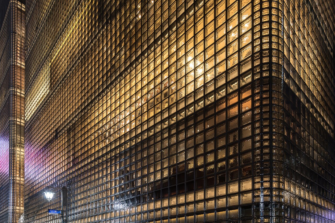 Exterior lighting detail highlighting textured glass block facade