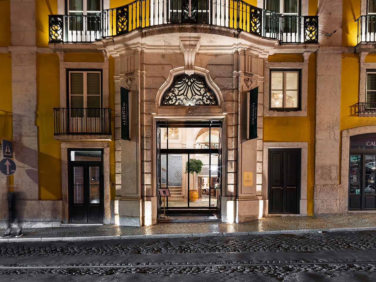 Luxury hotel exterior facade lighting creating welcoming ambiance